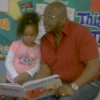 Me reading to my beautiful Granddaughter at her Preschool.